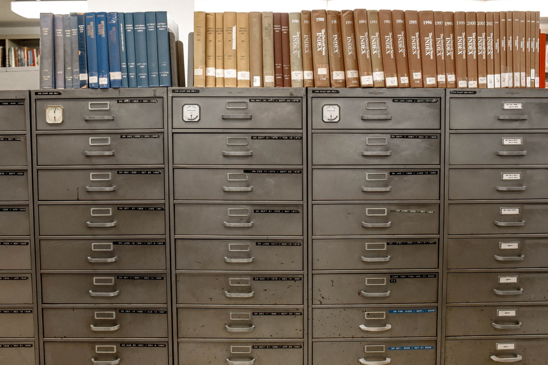 Rows of labelled record drawers in an archive